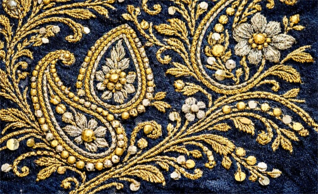 Golabatoon-Duzi embroidery with gold metallic thread, boteh motif, and floral arabesques on a dark blue velvet ground