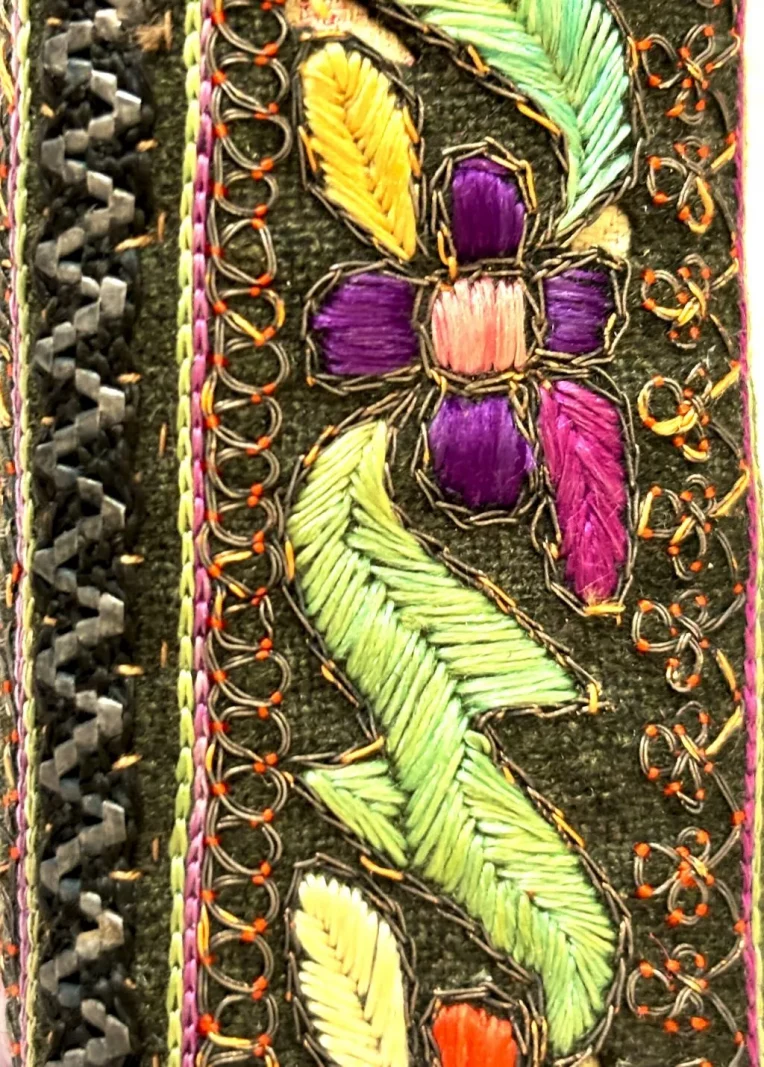 Detail of Persian embroidered qalamdan decoration showing silk embroidery and decorative metal thread work