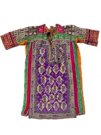 Baluch ceremonial dress from southeastern Iran with dense embroidery, mirror work, and colorful silk appliqué.